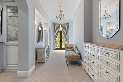 a room with pool table and windows