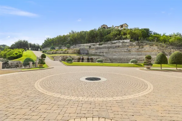a view of a swimming pool with a yard