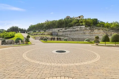 a view of a swimming pool with a yard
