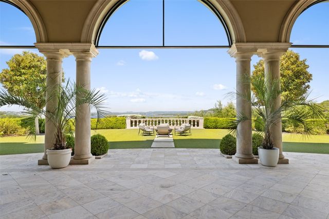 a view of a street with a building in the background