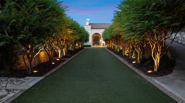 a view of a street with a building in the background