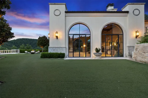 a view of a lake with a house in the background