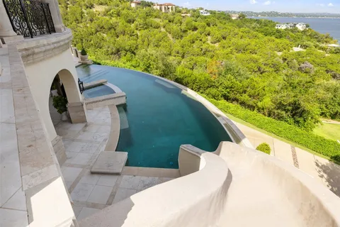 a view of balcony with furniture