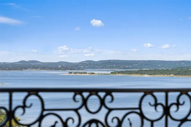 a view of swimming pool with a table and chairs