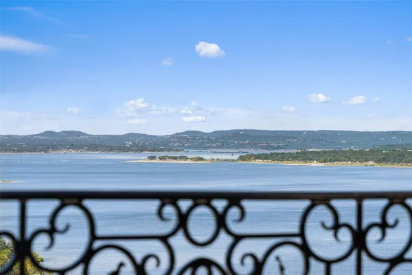 a view of swimming pool with a table and chairs