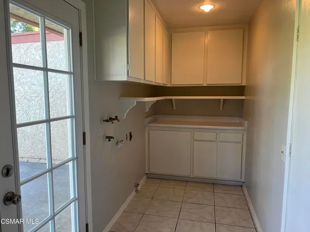 a utility room with cabinets
