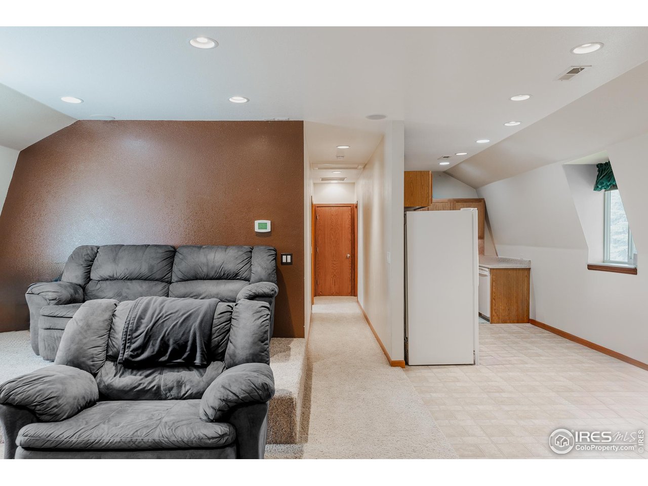6789 Niwot Road Longmont, CO 80503 - Photo 21 of 28 a living room with furniture and a couch