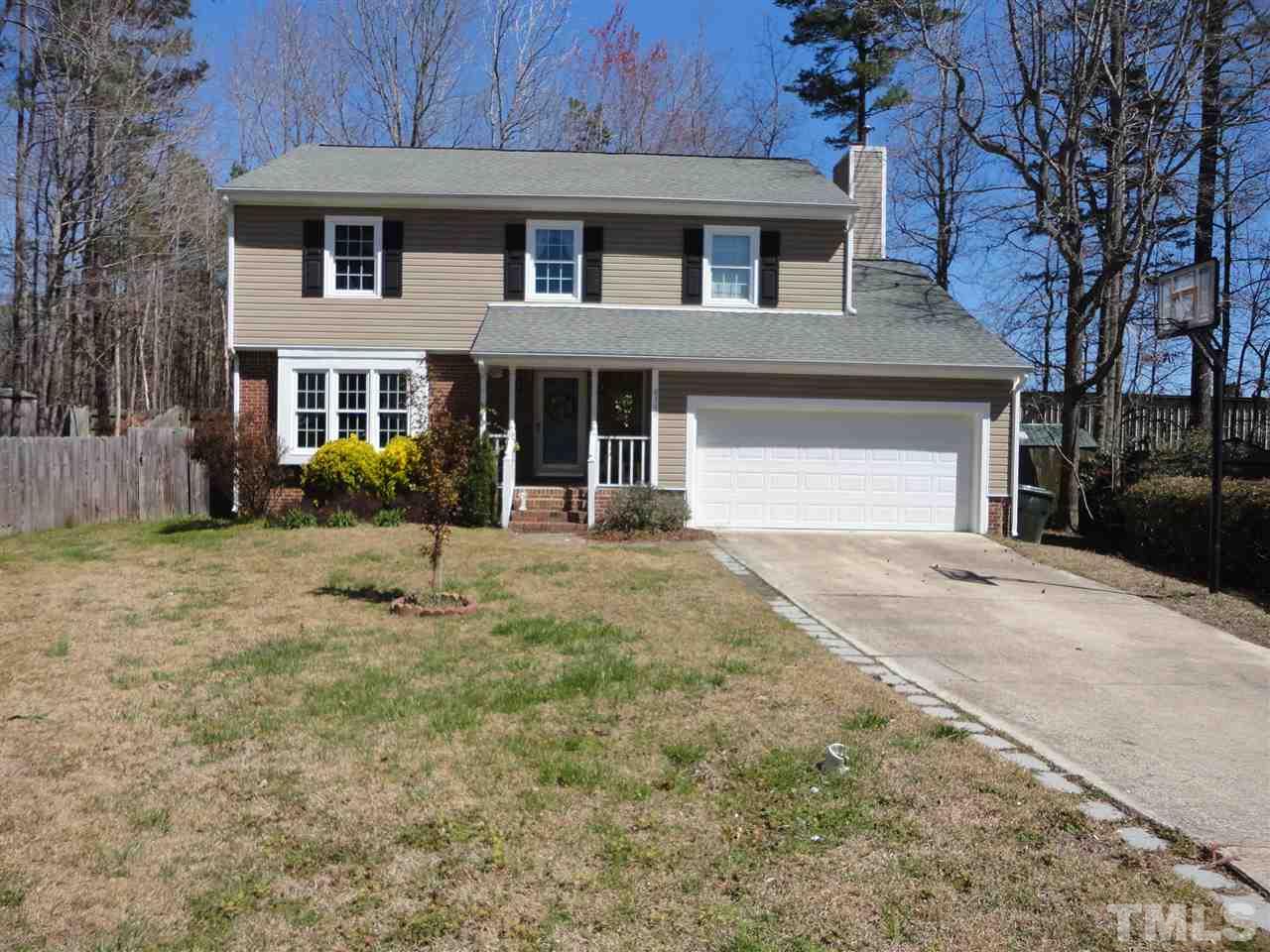 2369 Declaration Drive Raleigh, NC 27615 - Photo 1 of 20 a front view of a house with a yard and garage
