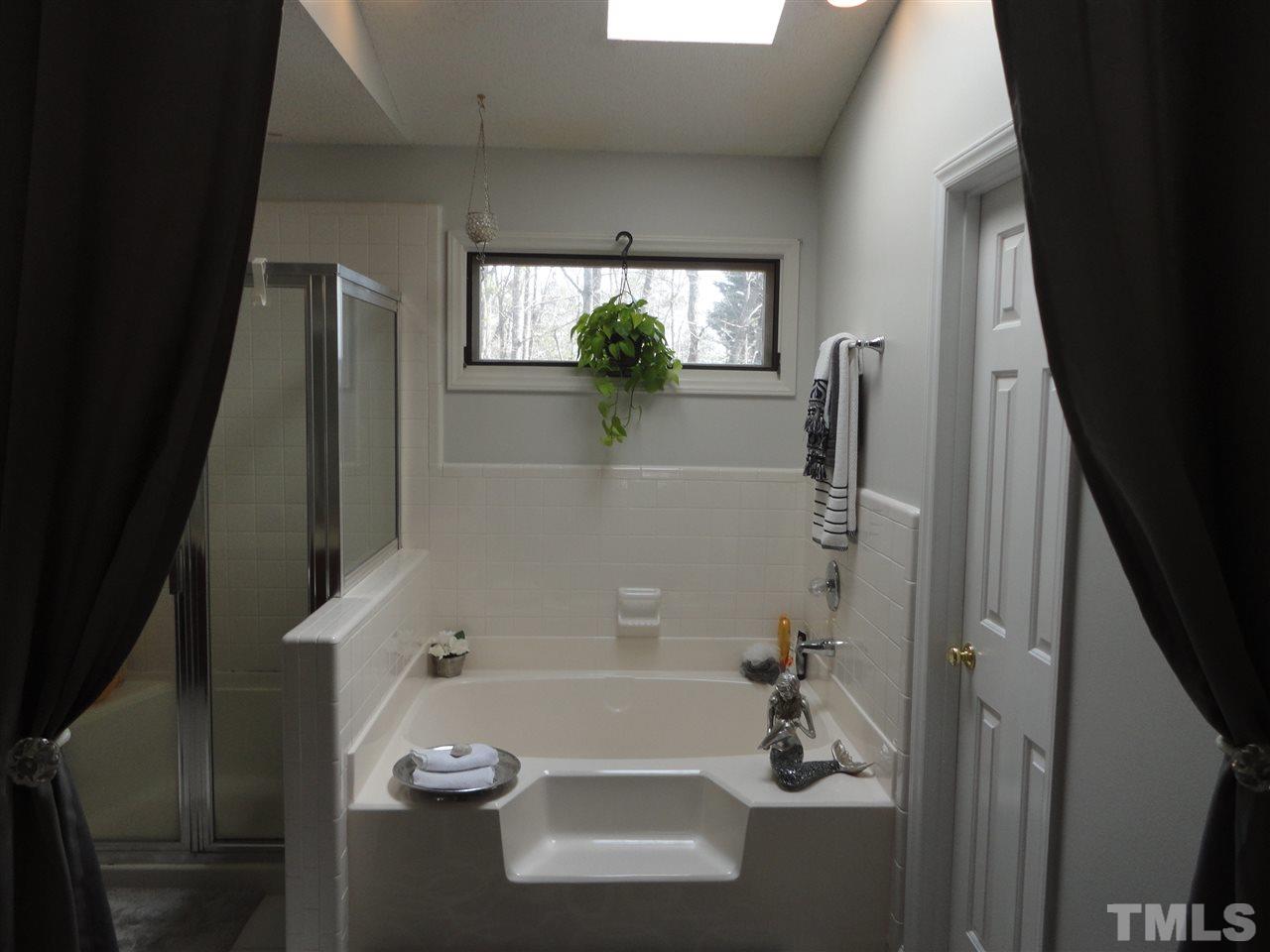 2369 Declaration Drive Raleigh, NC 27615 - Photo 15 of 20 a bathroom with a tub