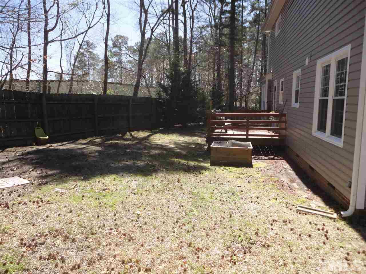 2369 Declaration Drive Raleigh, NC 27615 - Photo 17 of 20 a backyard of a house with lots of green space