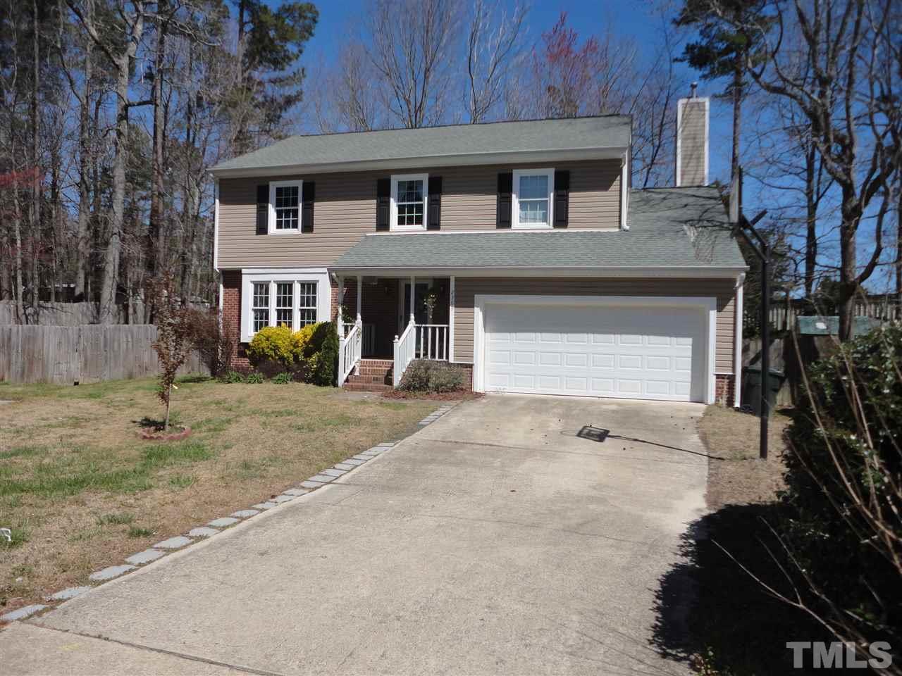 2369 Declaration Drive Raleigh, NC 27615 - Photo 3 of 20 a front view of a house with a yard and garage