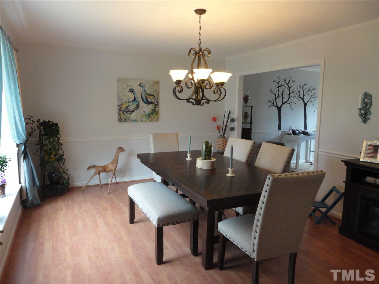 2369 Declaration Drive Raleigh, NC 27615 - Photo 4 of 20 a view of a dining room with furniture and wooden floor