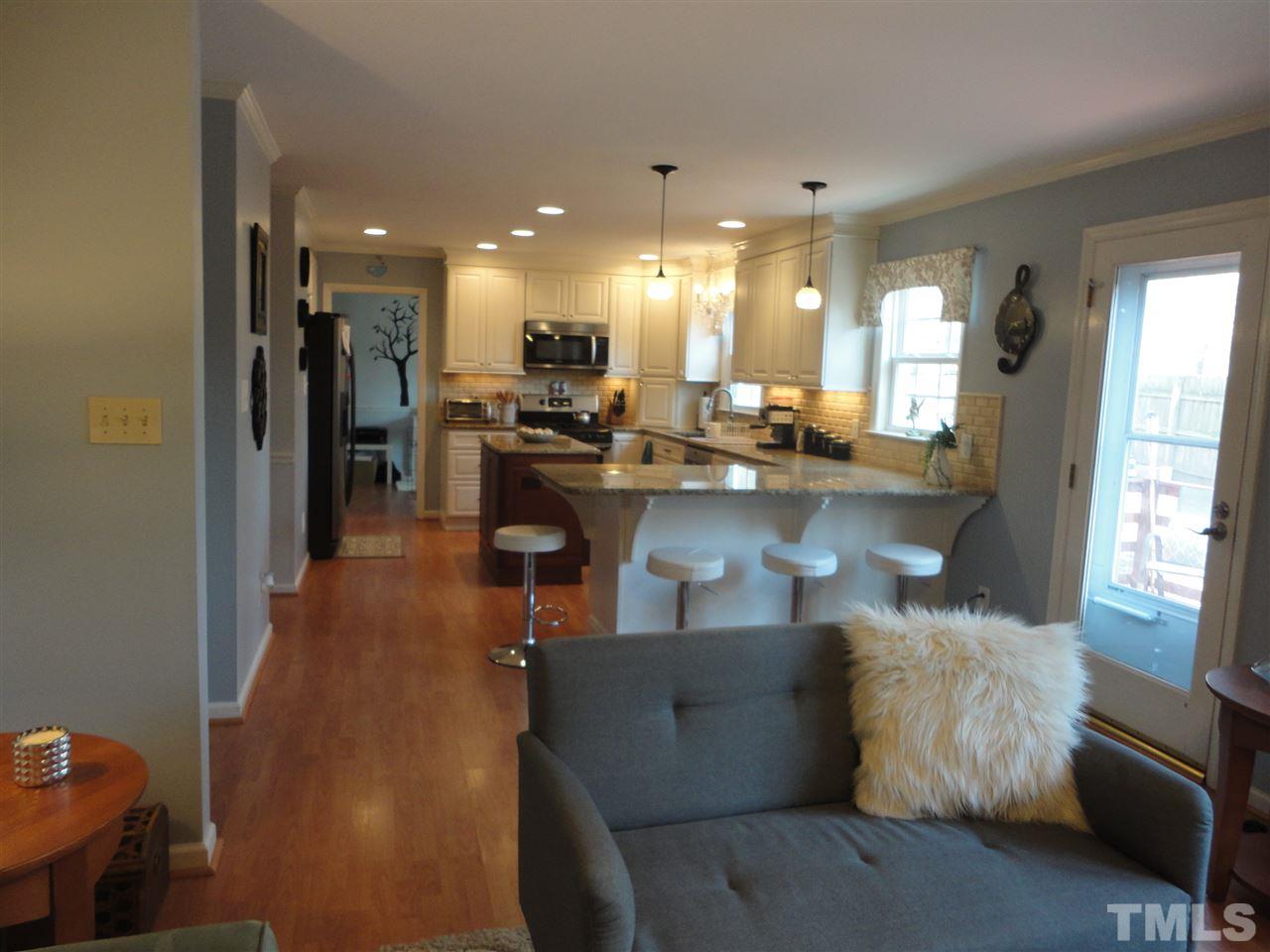 2369 Declaration Drive Raleigh, NC 27615 - Photo 10 of 20 a living room with furniture and kitchen view