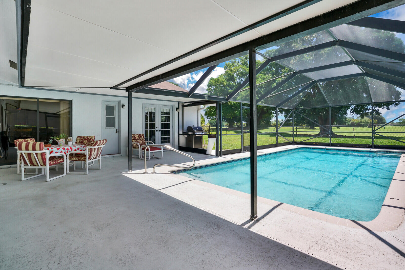 19620 Hampton Drive Boca Raton, FL 33434 - Photo 37 of 45 a view of a porch with chairs and backyard