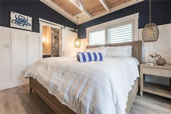 a bedroom with bed and window
