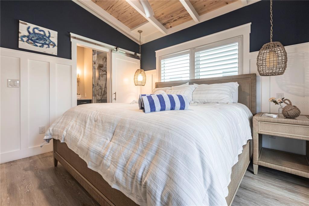 6020 Midnight Pass Road, Unit 39 Sarasota, FL 34242 - Photo 12 of 19 a bedroom with bed and window