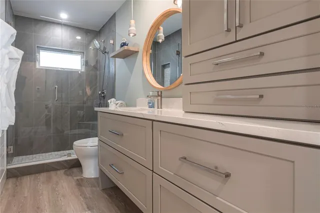a bathroom with a double vanity sink mirror double and shower