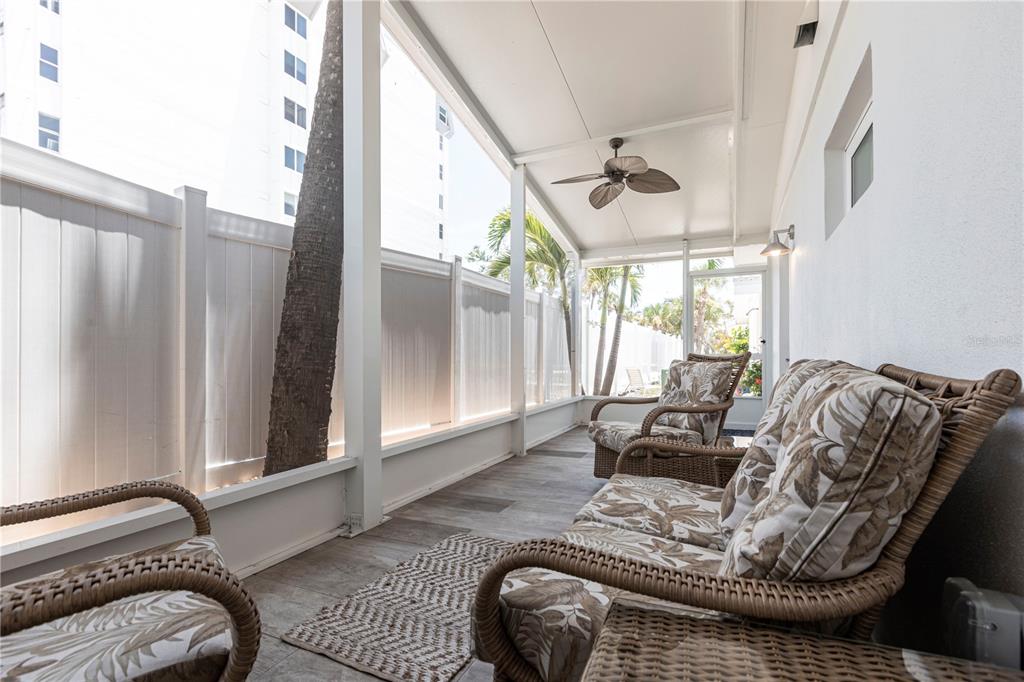 6020 Midnight Pass Road, Unit 39 Sarasota, FL 34242 - Photo 16 of 19 a living room with furniture and a large window