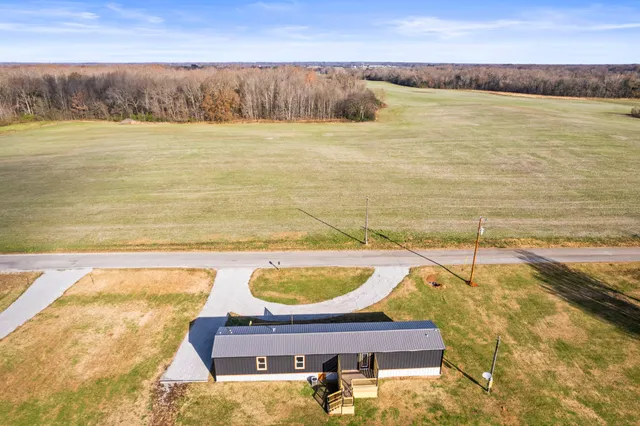 a view of a swimming pool and an outdoor seating
