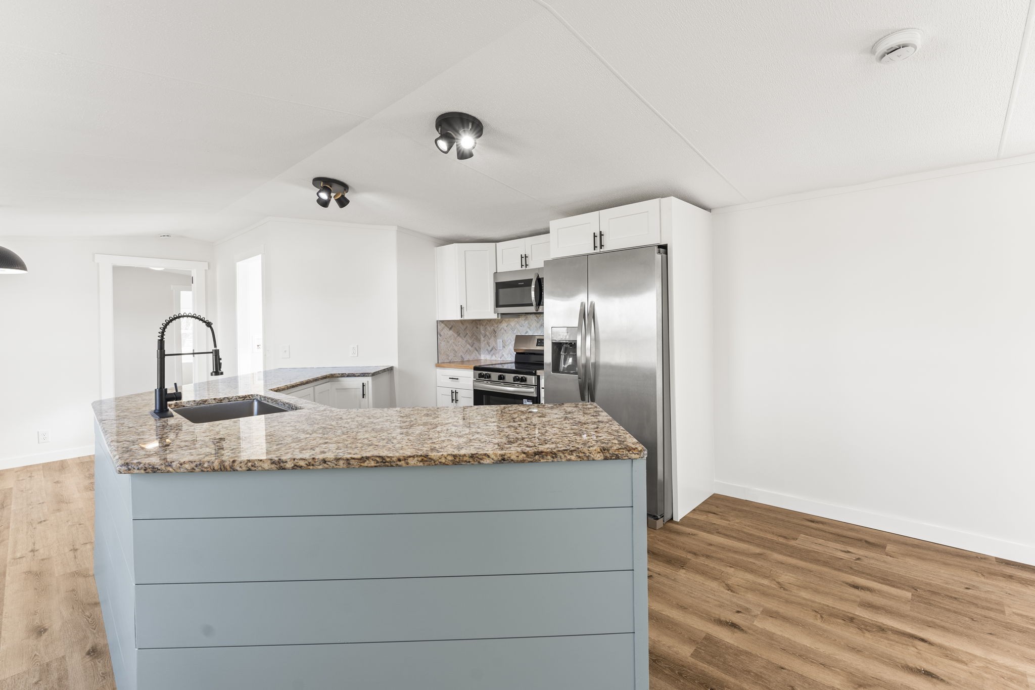 769 Stewart Road Huntland, TN 37345 - Photo 11 of 52 a kitchen with kitchen island a counter top a sink and appliances