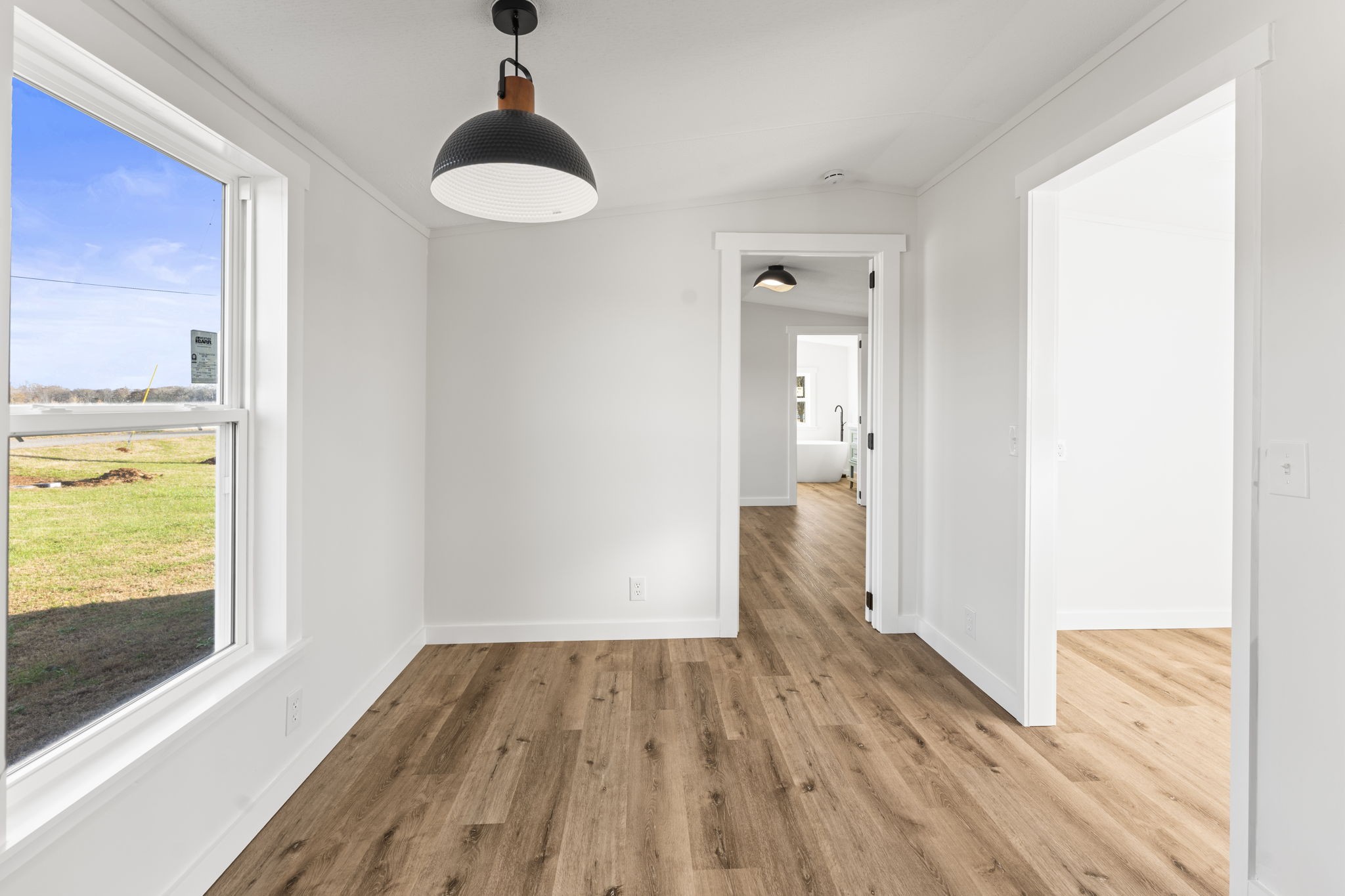 769 Stewart Road Huntland, TN 37345 - Photo 13 of 52 a view of a room with wooden floor staircase and a hallway