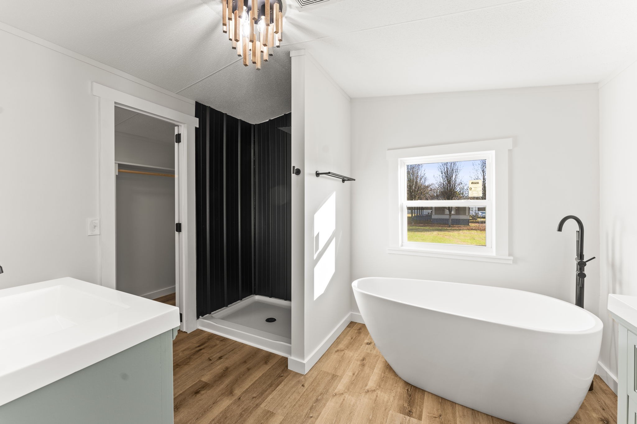 769 Stewart Road Huntland, TN 37345 - Photo 18 of 52 a bathroom with a sink a bathtub and a window