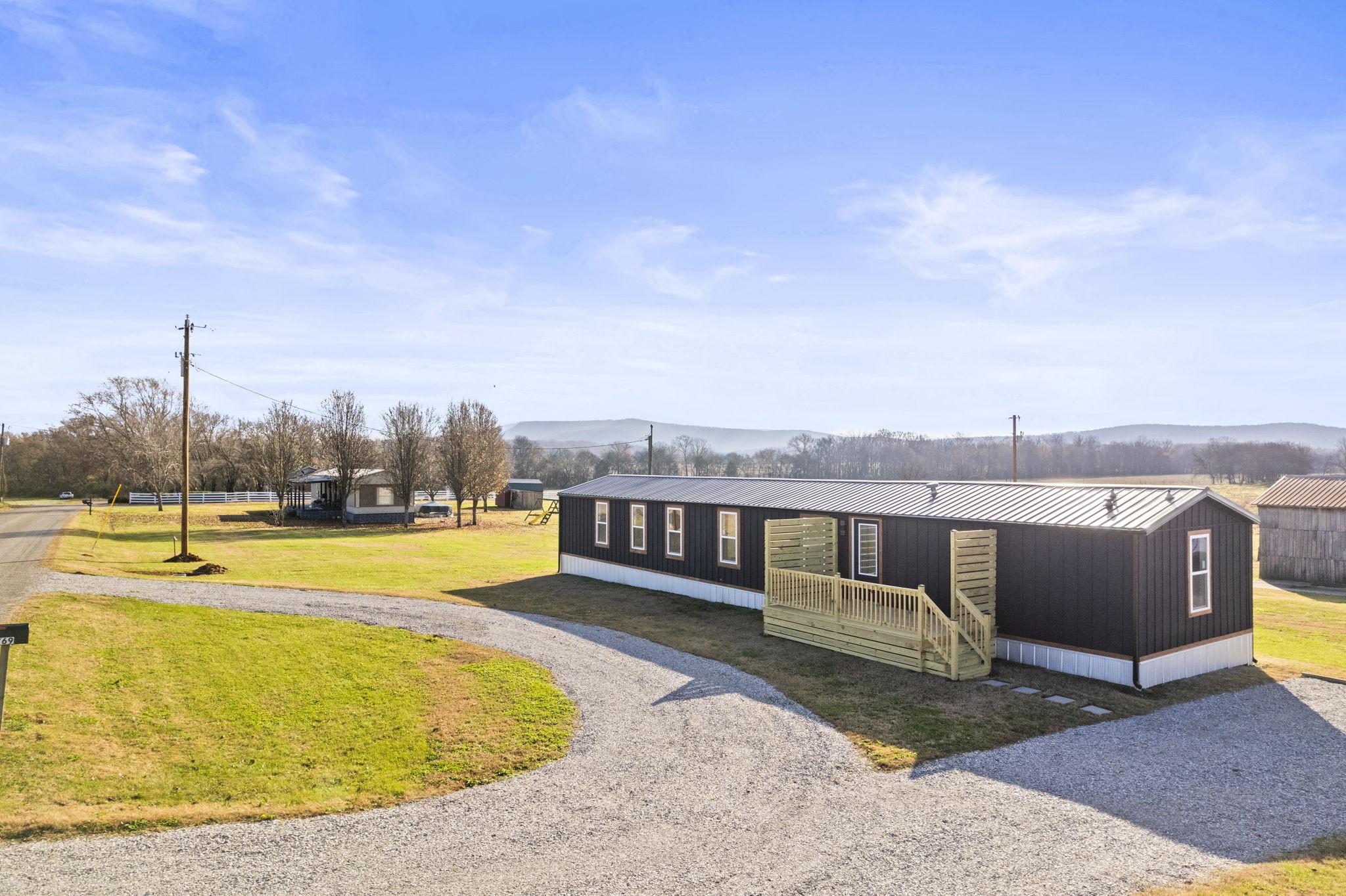 769 Stewart Road Huntland, TN 37345 - Photo 35 of 52 a view of a swimming pool with an outdoor seating and a yard