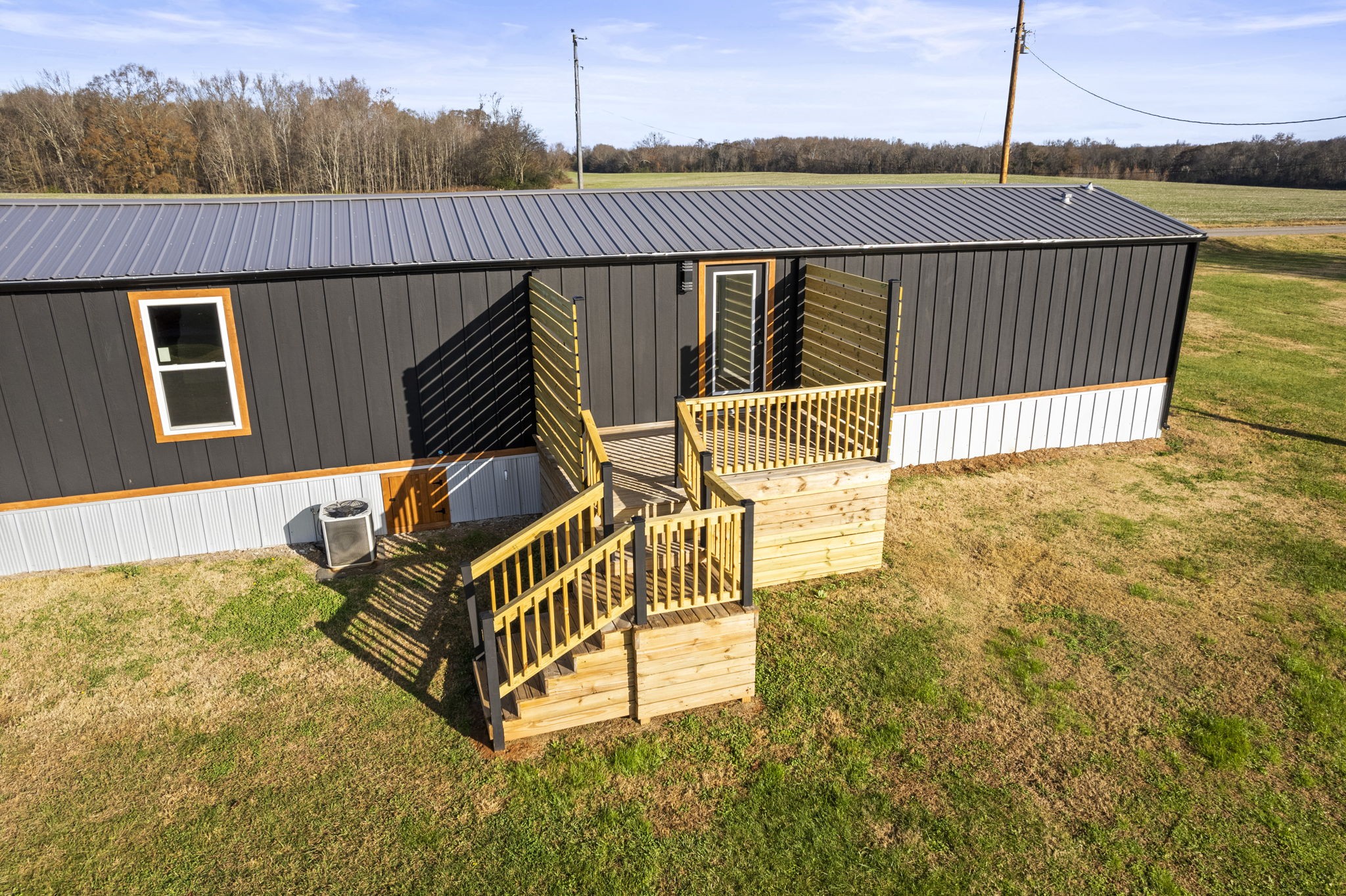 769 Stewart Road Huntland, TN 37345 - Photo 39 of 52 a view of a roof deck with couches and wooden fence