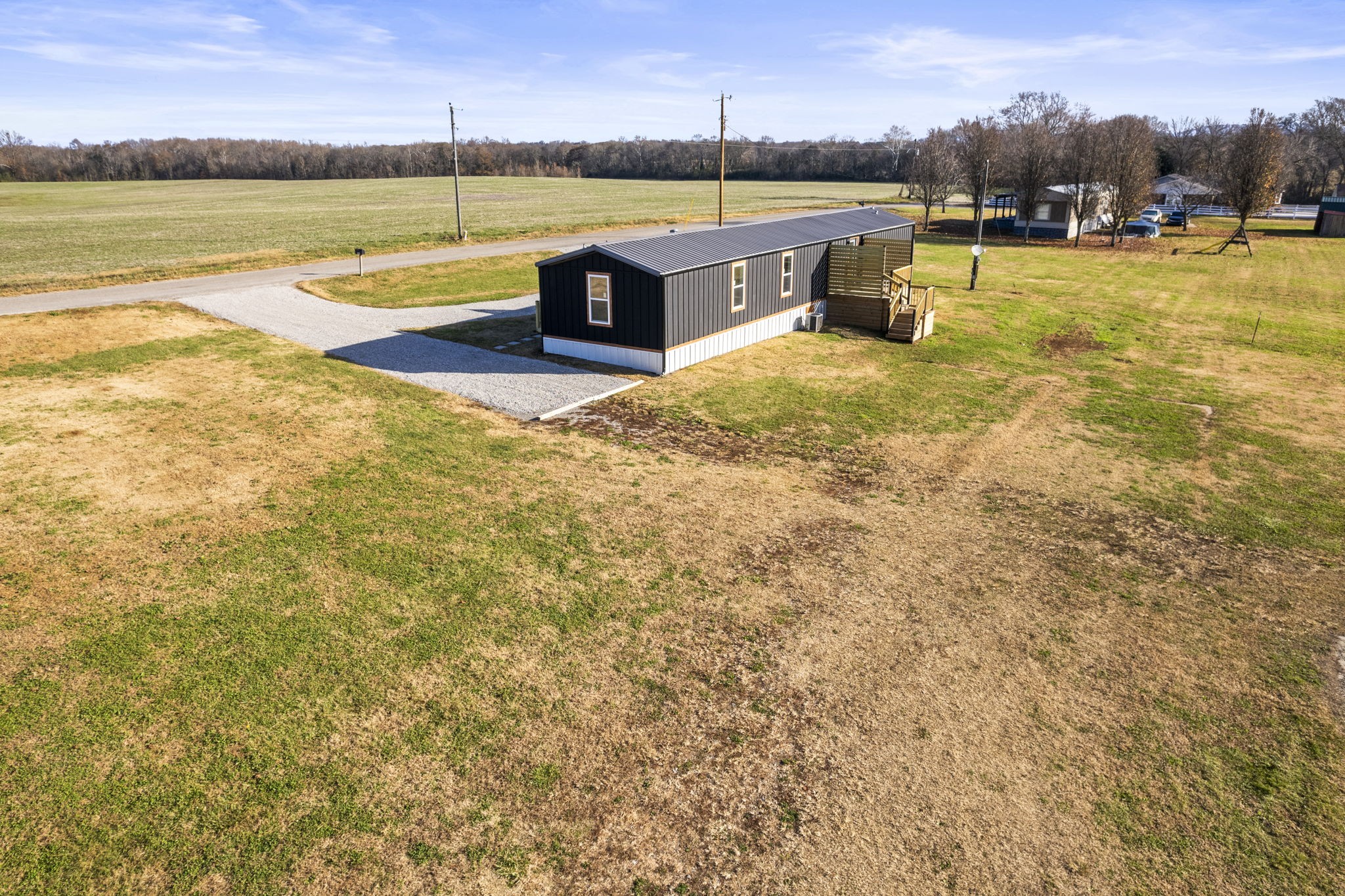769 Stewart Road Huntland, TN 37345 - Photo 40 of 52 a view of a swimming pool with an outdoor seating and a yard