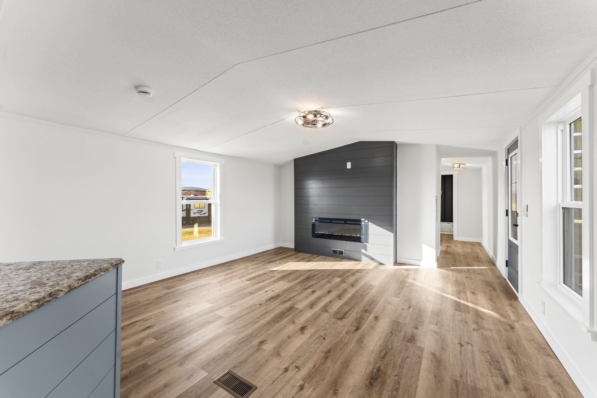 769 Stewart Road Huntland, TN 37345 - Photo 5 of 52 a view of empty room with wooden floor and fireplace