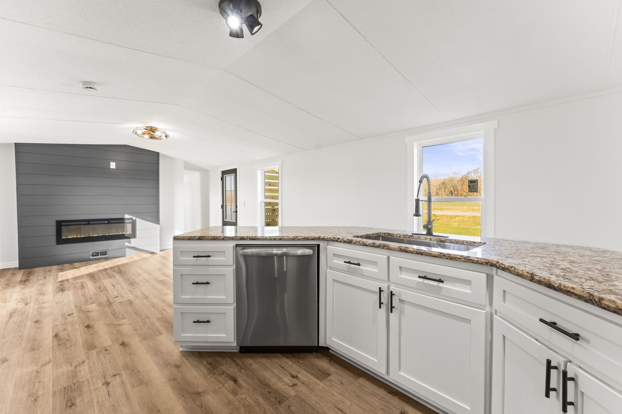 769 Stewart Road Huntland, TN 37345 - Photo 6 of 52 a kitchen with granite countertop a stove and a sink
