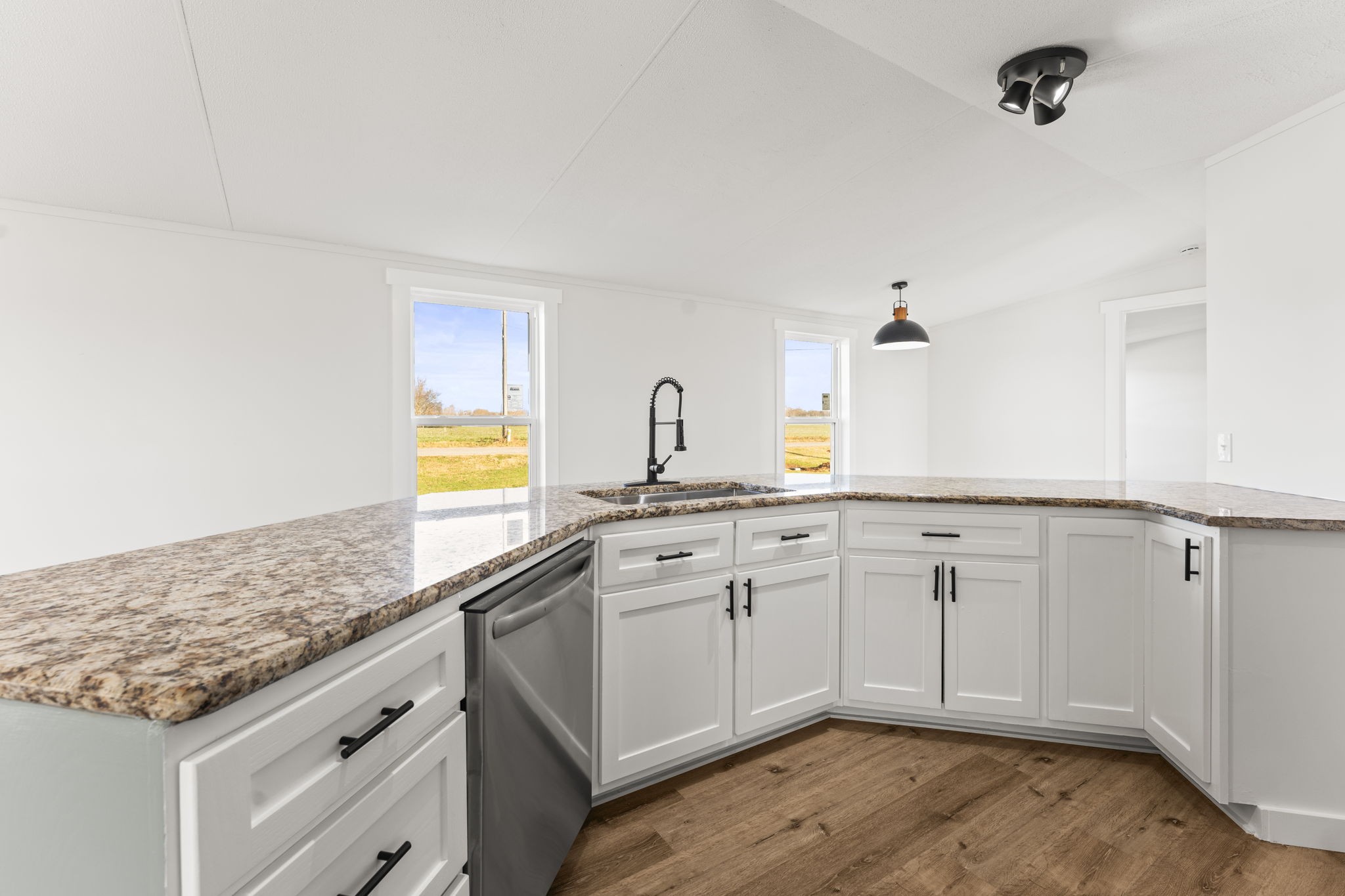 769 Stewart Road Huntland, TN 37345 - Photo 7 of 52 a spacious bathroom with a granite countertop sink and a mirror