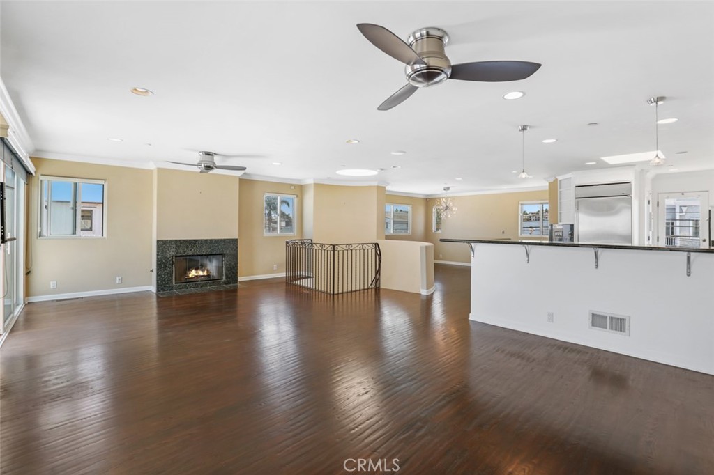 209 Crest Drive Manhattan Beach, CA 90266 - Photo 10 of 28 a view of a kitchen with furniture and wooden floor