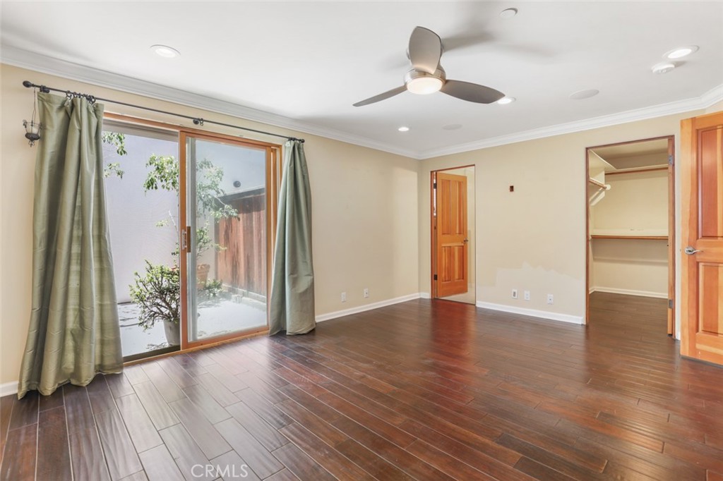 209 Crest Drive Manhattan Beach, CA 90266 - Photo 22 of 28 a view of an empty room with wooden floor and a window