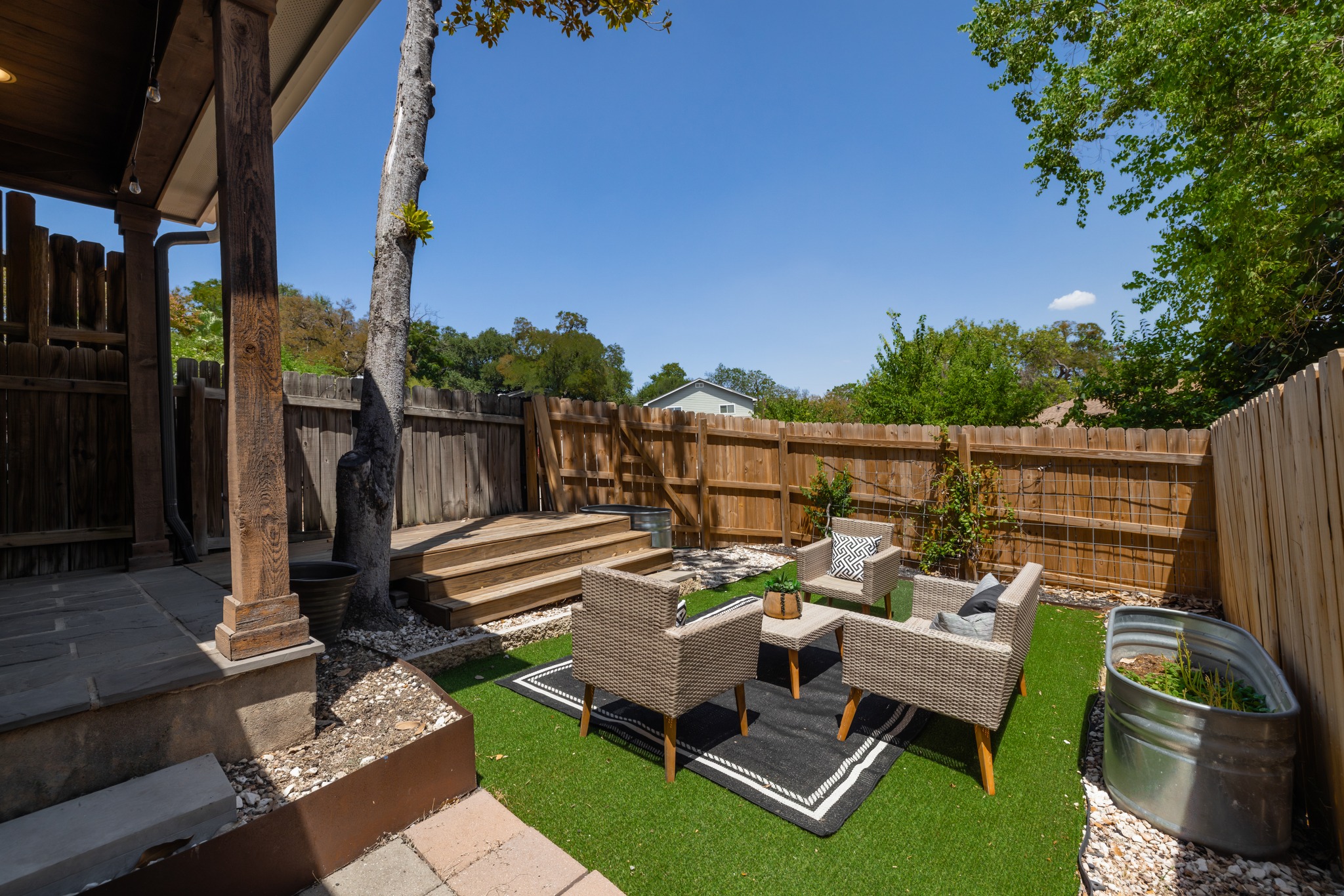 2000 Lightsey Road, Unit 5 Austin, TX 78704 - Photo 21 of 24 The partially covered deck is a beautiful and versatile feature. Whether you're hosting a summer barbecue or enjoying a slow morning coffee in the shade, this space is incredibly inviting