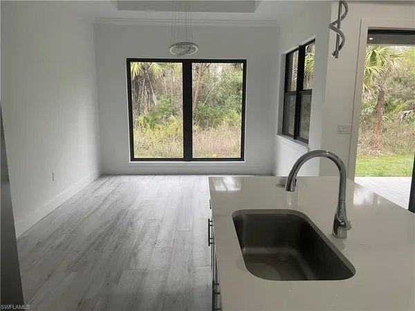 a bathroom with a sink and a large window