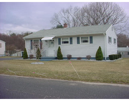 38 Regal Street Springfield, MA 01118 - Photo 2 of 14 a front view of a house with a yard and garage