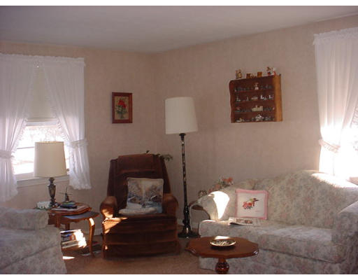38 Regal Street Springfield, MA 01118 - Photo 4 of 14 a living room with furniture and a lamp