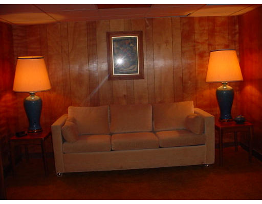 38 Regal Street Springfield, MA 01118 - Photo 10 of 14 a living room with furniture and a lamp