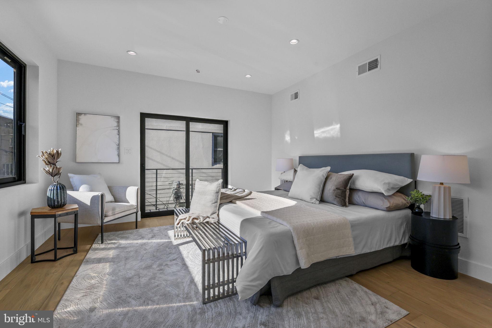 514 South 20th Street, Unit B Philadelphia, PA 19146 - Photo 15 of 52 a spacious bedroom with a bed and a couch