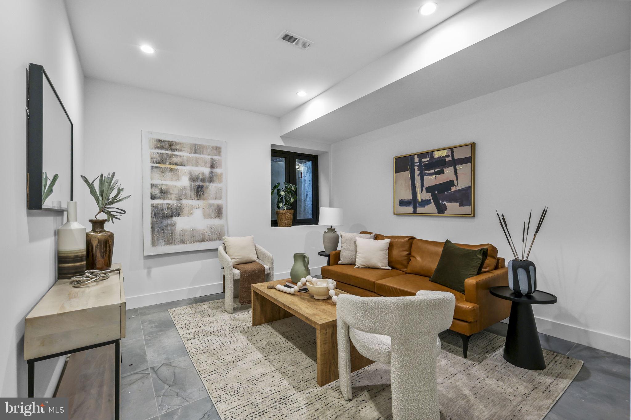 514 South 20th Street, Unit B Philadelphia, PA 19146 - Photo 34 of 52 a living room with furniture and a flat screen tv