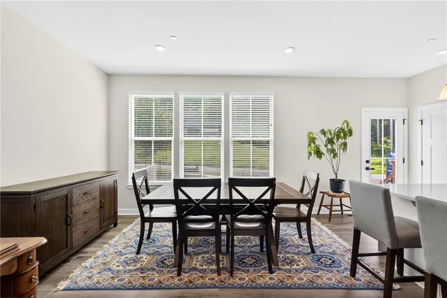 a view of a dining room with furniture and window
