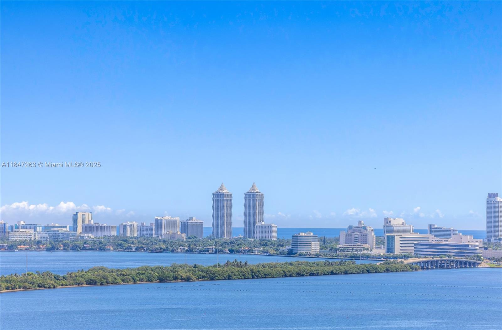 700 Northeast 24th Street, Unit 2101 Miami, FL 33137 - Photo 12 of 100 a view of a city with tall buildings and a bench
