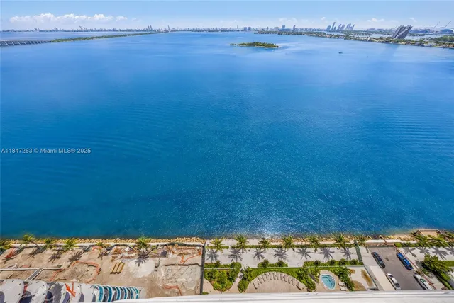 a view of an empty room with a staircase