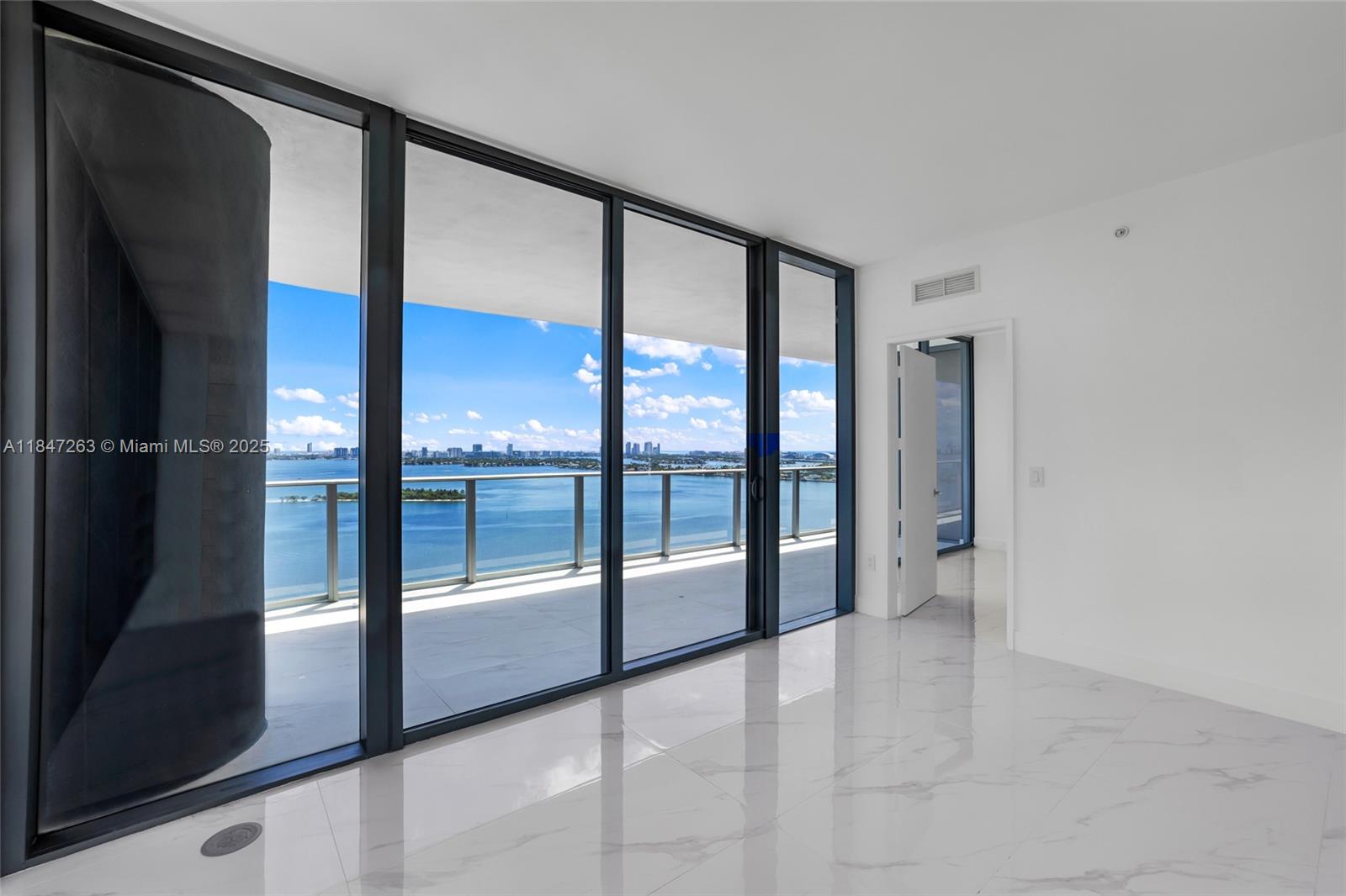 700 Northeast 24th Street, Unit 2101 Miami, FL 33137 - Photo 30 of 100 a view of an entryway with a floor to ceiling window