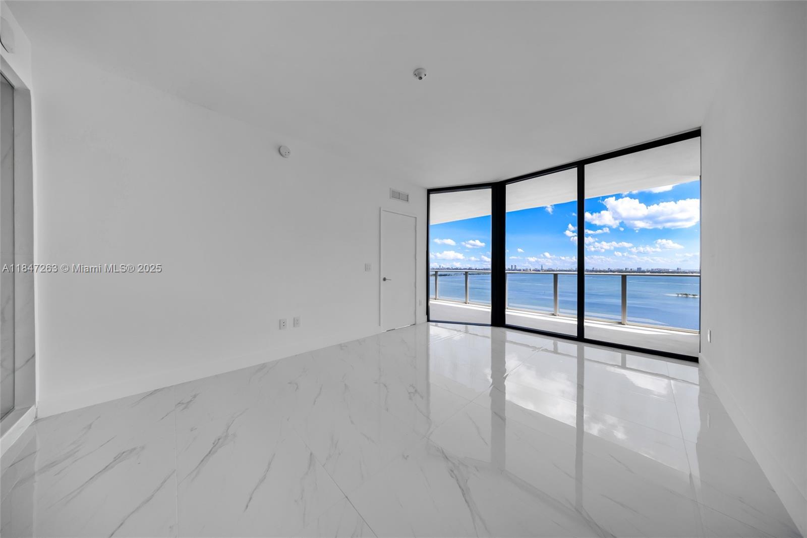 700 Northeast 24th Street, Unit 2101 Miami, FL 33137 - Photo 36 of 100 wooden floor in an empty room with a window