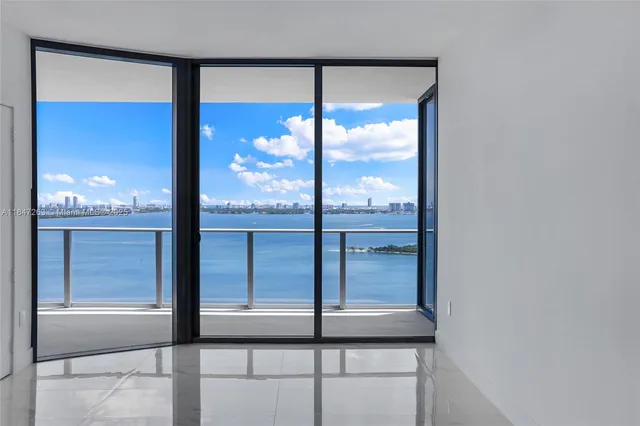 a view of walk in closet with clothes