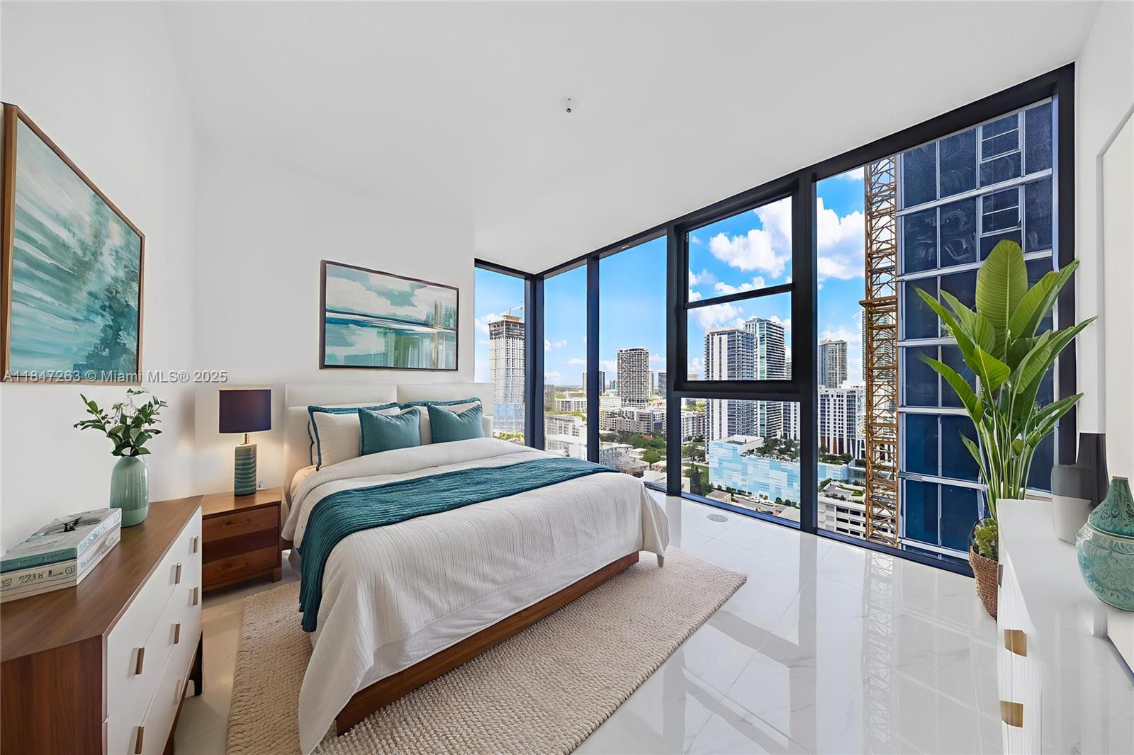 700 Northeast 24th Street, Unit 2101 Miami, FL 33137 - Photo 48 of 100 a bedroom with a large bed and a large window