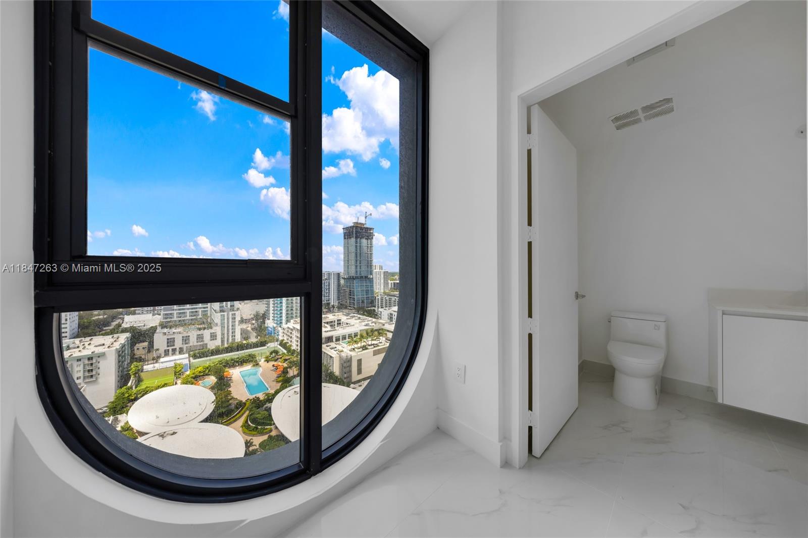 700 Northeast 24th Street, Unit 2101 Miami, FL 33137 - Photo 58 of 100 a bathroom with a toilet and a sink