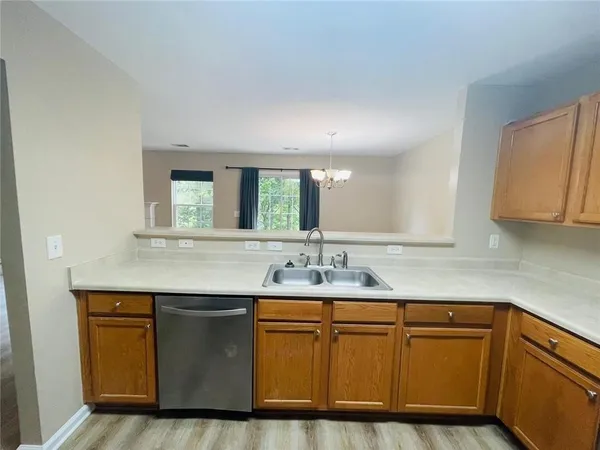 a kitchen with stainless steel appliances granite countertop a sink and cabinets